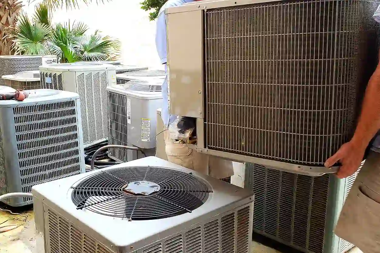 Miller Cooling & Heating technician servicing an outdoor HVAC unit in South Texas